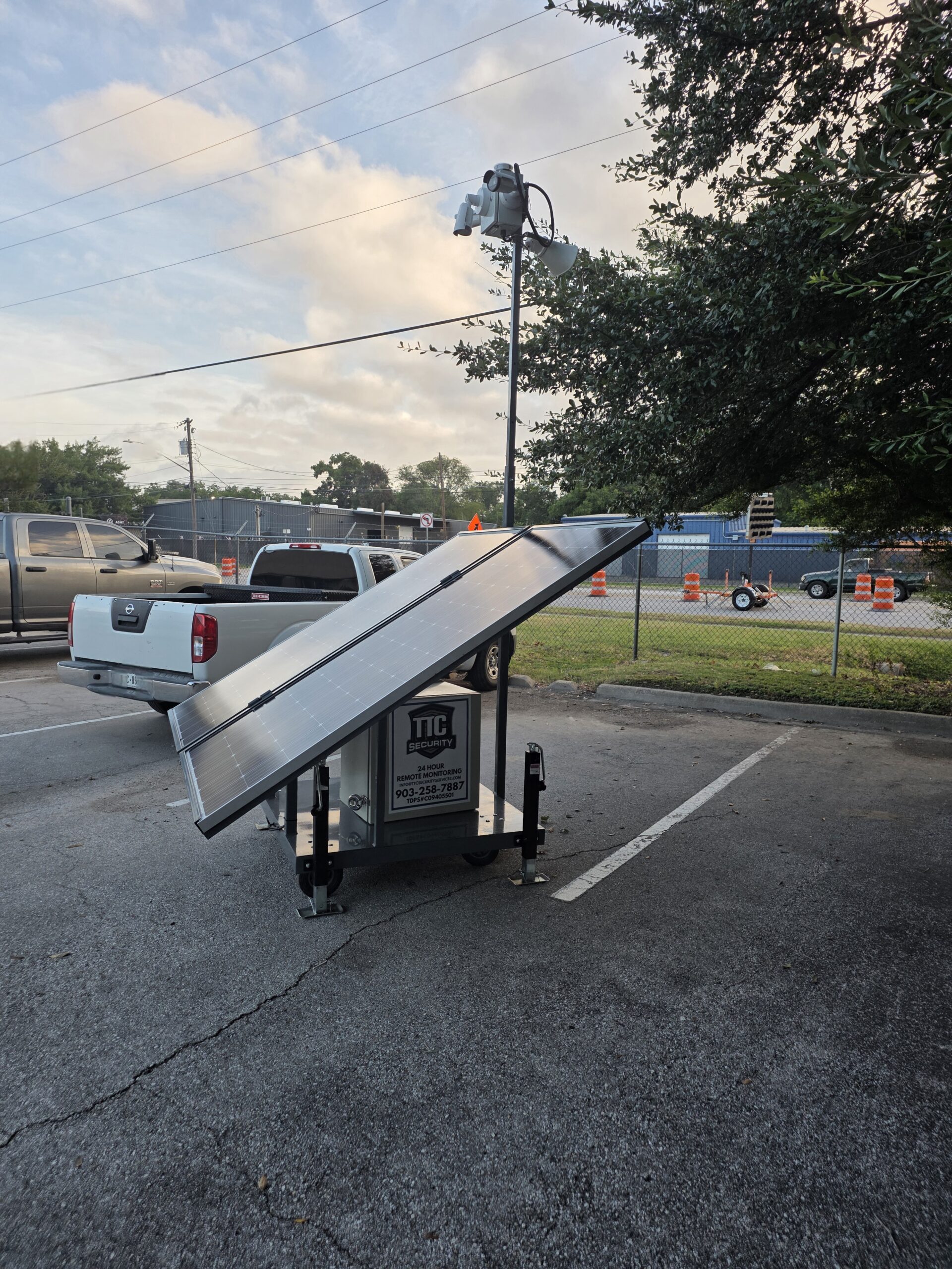 Mobile solar-powered security camera trailer providing 24/7 remote surveillance for a commercial property in Austin, Texas.